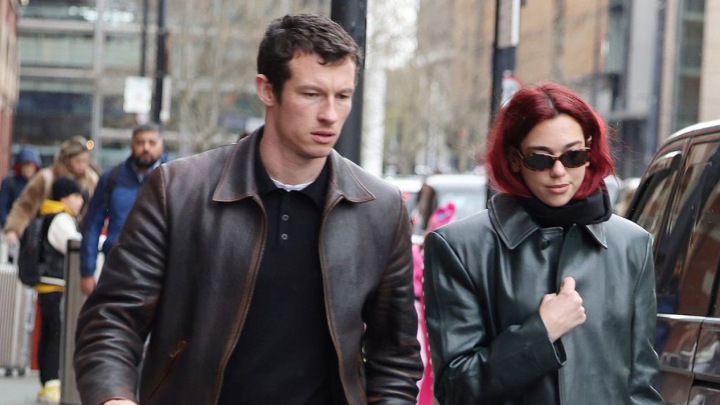 Dua Lipa and Callum Turner arriving at London St Pancras Station after taking the Eurostar from Paris on March 26, 2024 in London, England.